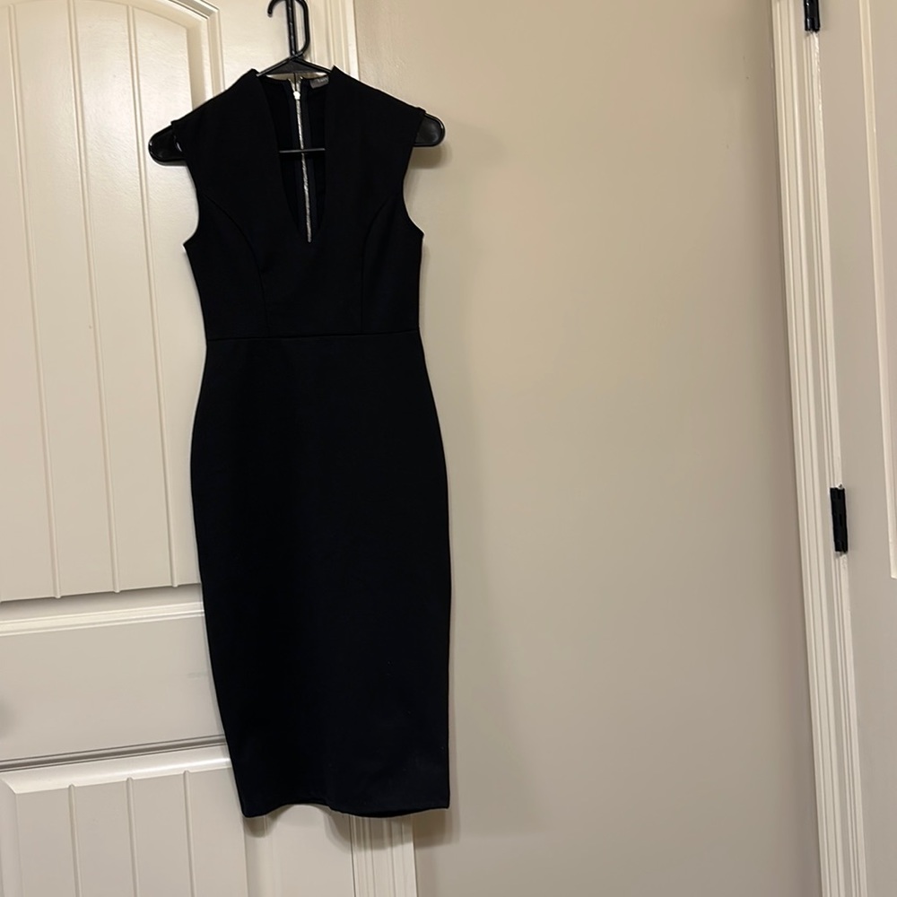 Black elegant tight fitting dress shows off your lovely curves must I say more!l